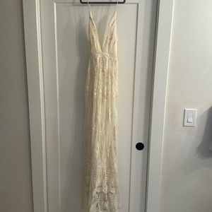 Wishlist apparel cream lacy dress. Dress is lined, adjustable straps.